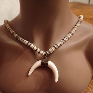 Tribal-Inspired Beaded Necklace with Crescent Pendant"